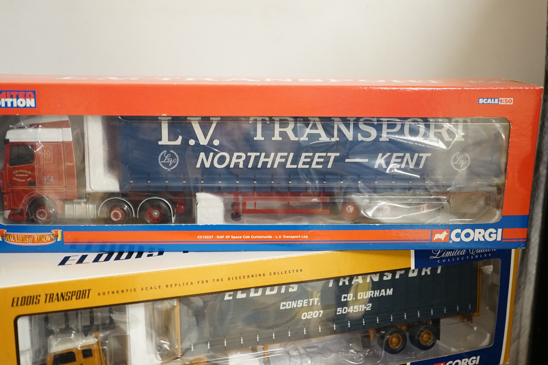 Four boxed Corgi 1:50 scale articulated trucks; a DAF XF Space Cab Curtainside lorry (CC13227), a MAN TGA curtainside lorry (CC13403), a Scania Topline with Fridge Trailer (CC12929) and a Volvo F88 Tautliner curtainside